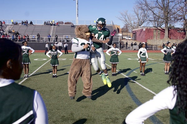 <p><p>GHS' Jordan Alexander jumps on the Bears mascot during player introductions Thursday morning. (Bas Slabbers/for NewsWorks)</p></p>
