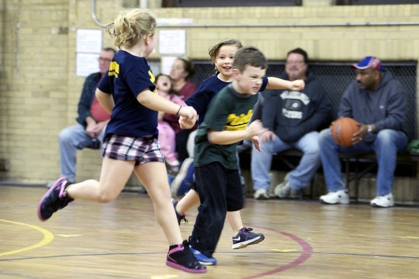 <p><p>Two girls celebrate a play as they run to the other side of the court. (Bas Slabbers/for NewsWorks)</p></p>
