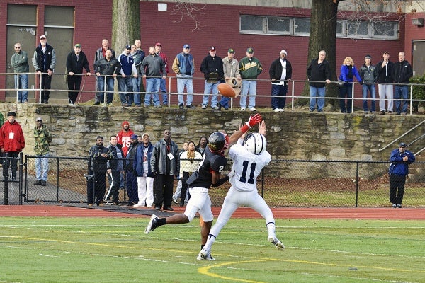 <p><p>Imhotep's Nyeem Thrones attempts to stop Wyomissing's from catching a pass Joe Cacchione. (Bas Slabbers/for NewsWorks)</p></p>
