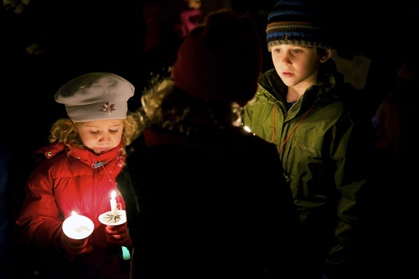 <p><p>Young children watch as the candles light up the park. (Bas Slabbers/for NewsWorks)</p></p>
