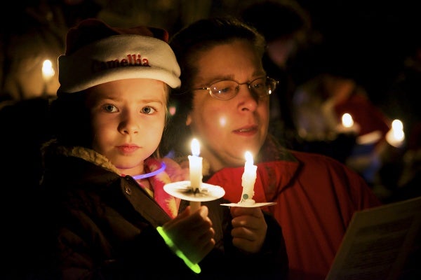 <p><p>Some carolers used two candles for better illumination. (Bas Slabbers/for NewsWorks)</p></p>
