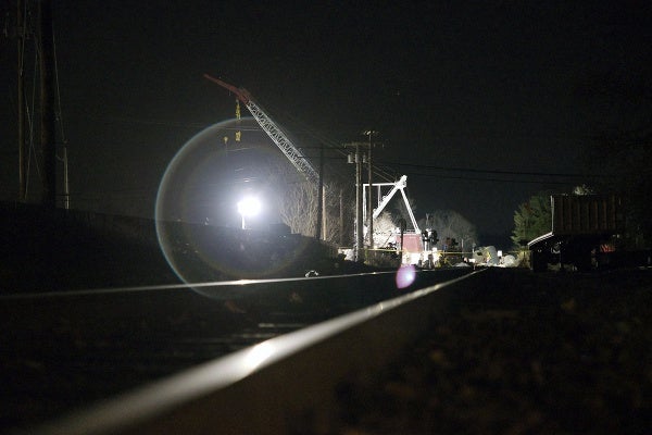 <p><p>Work lights falls on the train track leading towards the derailment site. (Bas Slabbers/for NewsWorks)</p></p>
