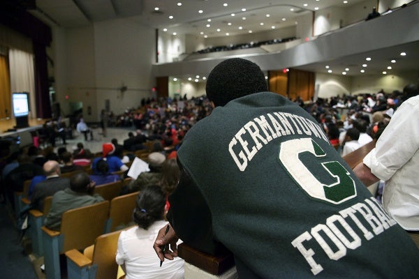 <p><p>A man in a Germantown High football jacket looks over the crowd. The district's plan proposes that GHS students transfer move to Martin Luther King High or Roxborough High. (Bas Slabbers/for NewsWorks)</p></p>
