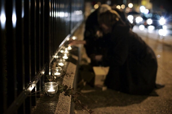 <p>Candles are lit on the 5900 block of Germantown Avenue. (Bas Slabbers/for NewsWorks)</p>
