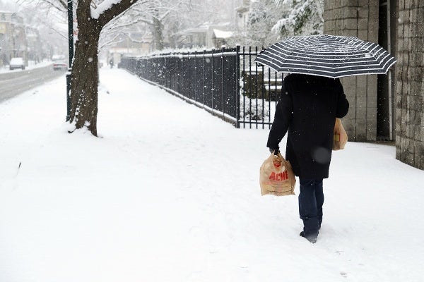 <p>A person walks on the 6900 block of Germantown Avenue. (Bas Slabbers/for NewsWorks)</p>
