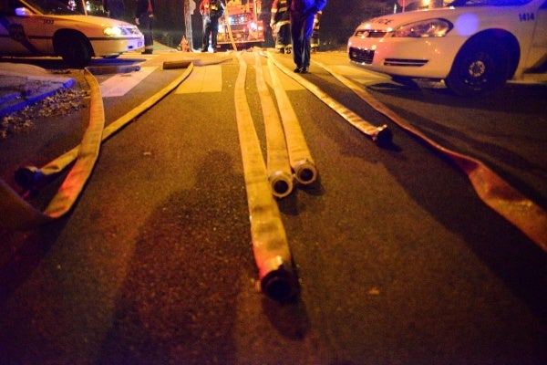 <p><p>Hoses lay over the nearby intersection of Carpenter and Cresheim. (Bas Slabbers/for NewsWorks)</p></p>
