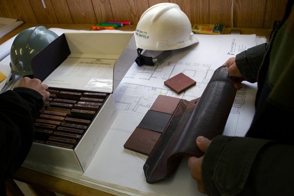 <p><p>A roof tile manufactur tries to match samples of their product with an original tile of the building. (Bas Slabbers/for NewsWorks)</p></p>
