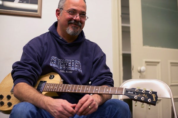 <p>A smile from John Hohenstein as he listens. (Bas Slabbers/for NewsWorks)</p>
