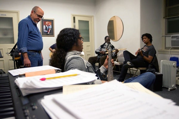 <p>Ed Wise (left) teaches a guitar class at the Settlement Music School in Germantown. (Bas Slabbers/for NewsWorks)gp</p>
