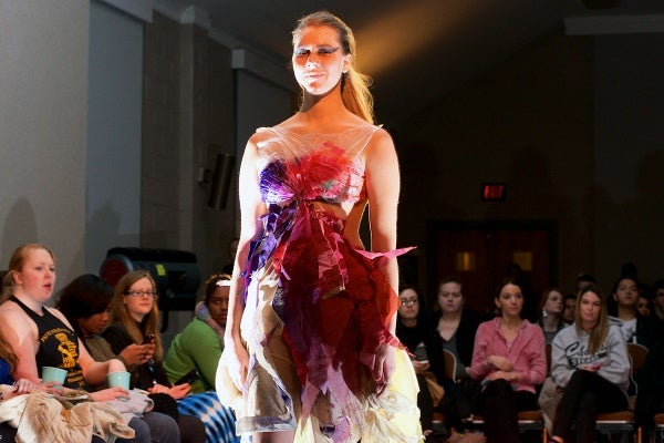<p><p>Hannah shows a colorful dress with shreds of paper by Shannon Mckernan. (Bas Slabbers/for NewsWorks)</p></p>
