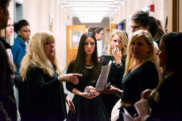 <p><p>The design team goes over final preparations in the hallway before the show starts. (Bas Slabbers/for NewsWorks)</p></p>
