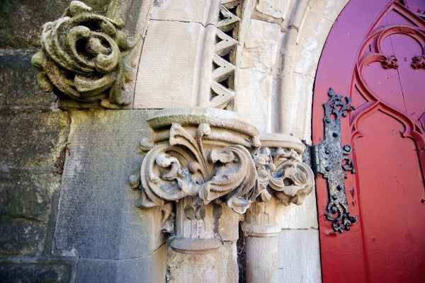 <p><p>Most of the metal roof ornamentation remains, and carved faces peer down from stone doorways near a stone breezeway and port-cochere. (Bas Slabbers/for NewsWorks)</p></p>
