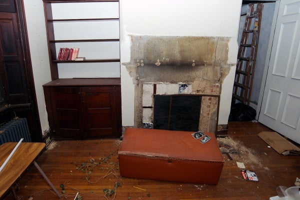 <p><p>Tiles around this fireplace in the house are missing. (Bas Slabbers/for NewsWorks)</p></p>
