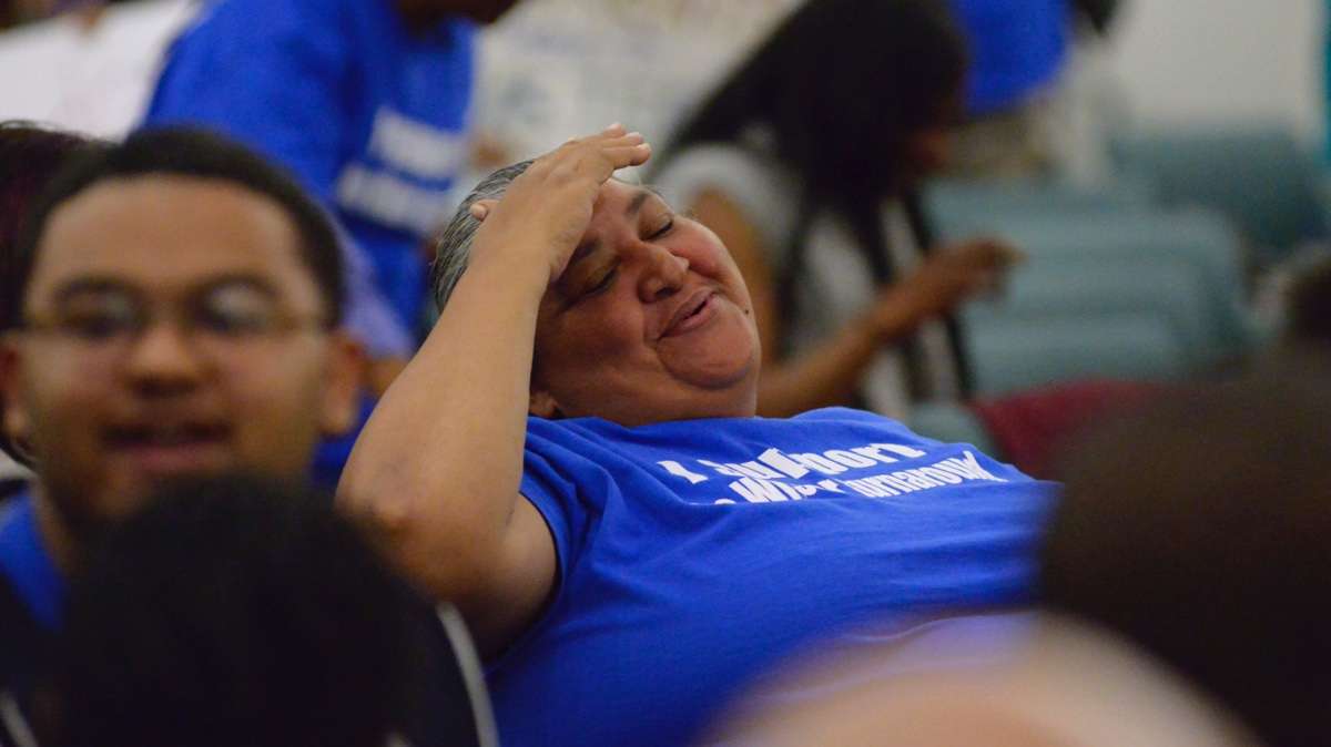Anna Figueroa, a grandmother to five students at Wister, and friend of Simms and Divine, smiled when the conversion became official. (Bastiaan Slabbers for WHYY)
