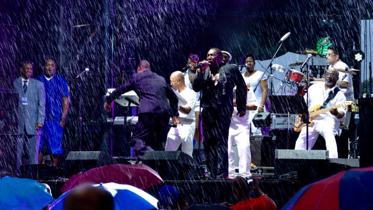 Umbrellas go up once the rain comes down during a tribute to Kenny Gamble and Leon Huff celebrating the Sound of Philadelphia.