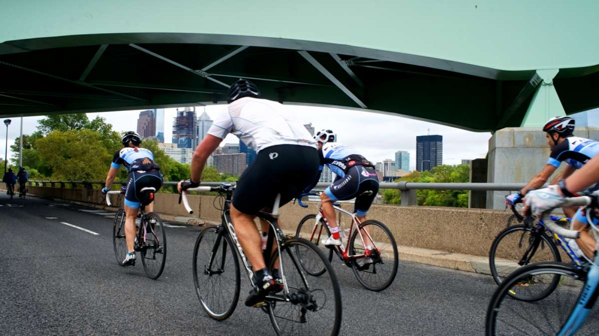 The temporary car-free zone at South Street is connected by the Schuylkill River Trail to Martin Luther King Jr. Drive, creating a ten-mile-long haven for cyclists. (Bastiaan Slabbers for NewsWorks)