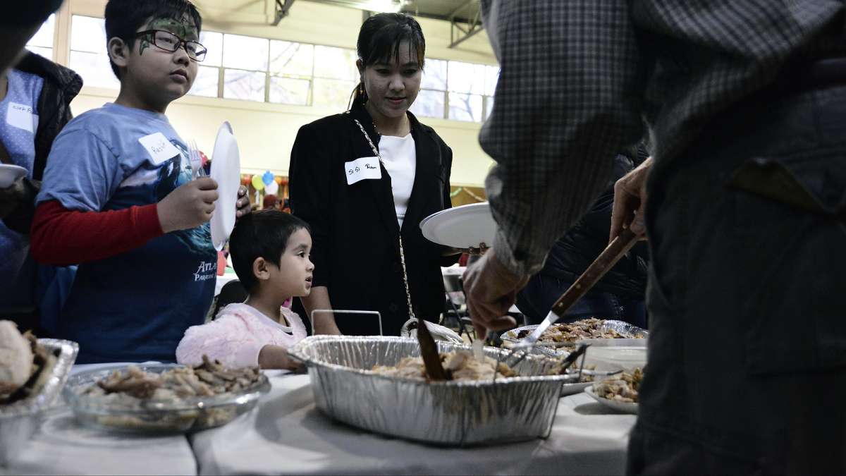 There were plentiful options to choose from at the annual Thanksgiving dinner for refugees at the Old Pine Community Center on Sunday. (Bastiaan Slabbers for NewsWorks)