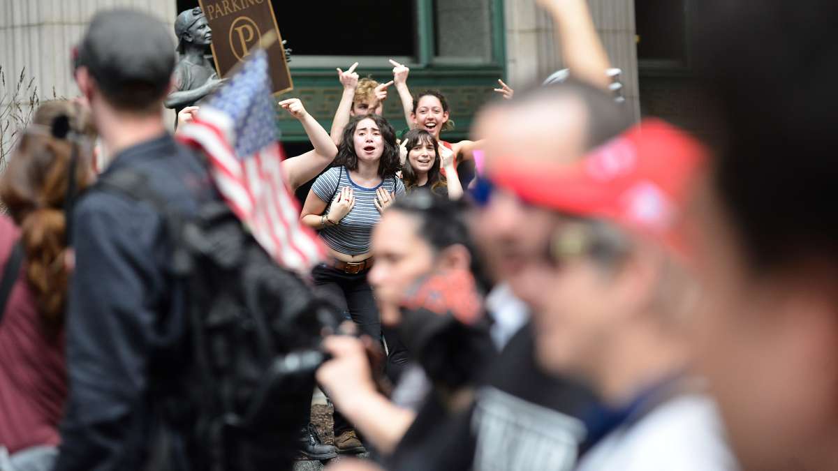  Demonstrators who support President Donald Trump and those protesting his policies converge in Philadelphia Saturday. (Bas Slabbers for NewsWorks) 