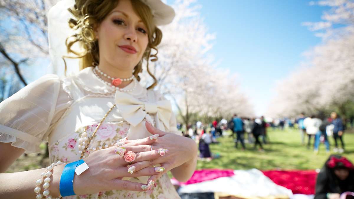 Stephanie Altmiller of Feasterville, Pennsylvania, shows off her Japanese Lolita-style street fashion as she poses during the annual Cherry Blossom Festival in Fairmount Park on Sunday.
