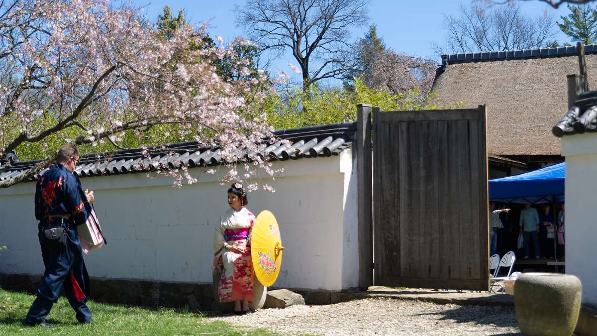 Rachel Cohen of New Jersey poses in a Geisha costume outside the Shofuso Japanese House as Mark Gorman of Philadelphia takes photos.