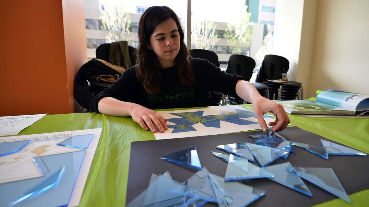 Katie Rowlett works on a puzzle inspired by innovator Richard Buckminster Fuller at Microsoft Reactor at the University City Science Center.
