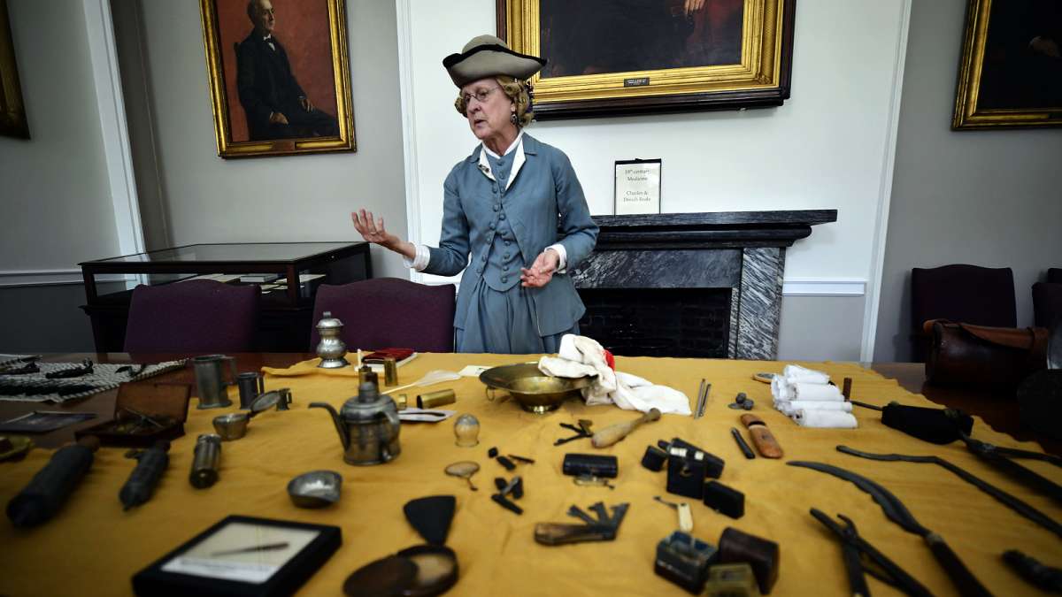 In the Apothecary Room at Pennsylvania Hospital, Donah Beala shows items from her collection of antique medical tools.