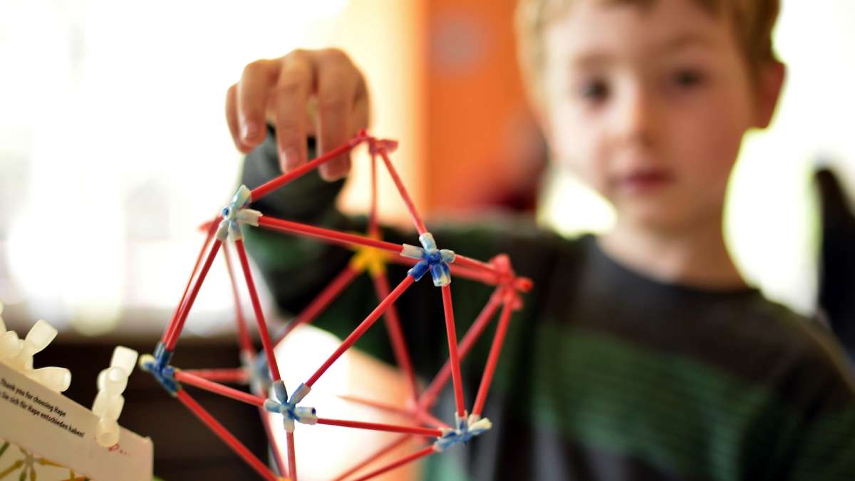 August Clayton, 5, builds a geodesic dome, a shape popularized by innovator Richard Buckminster Fuller.