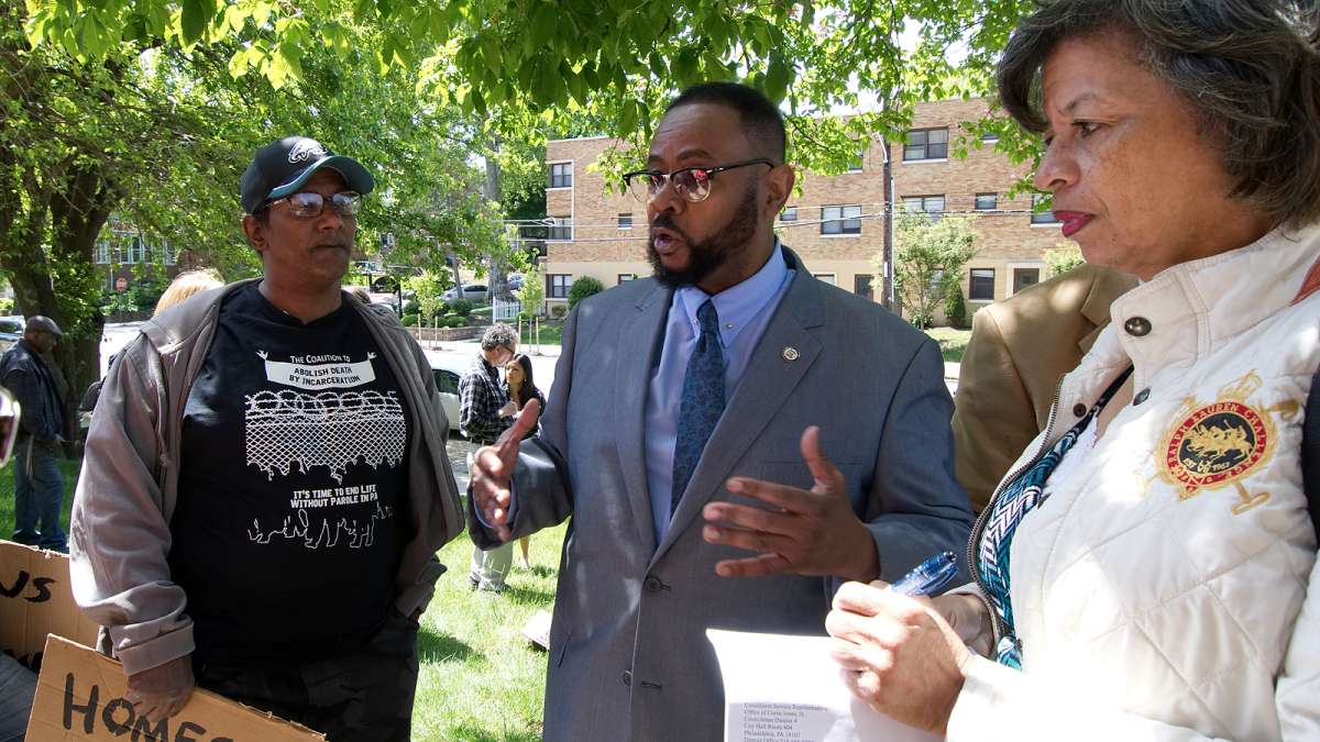 Councilman Curtis Jones, Jr. talks to residents after the anti-eviction rally at Penn Wynn House, on Wednesday.