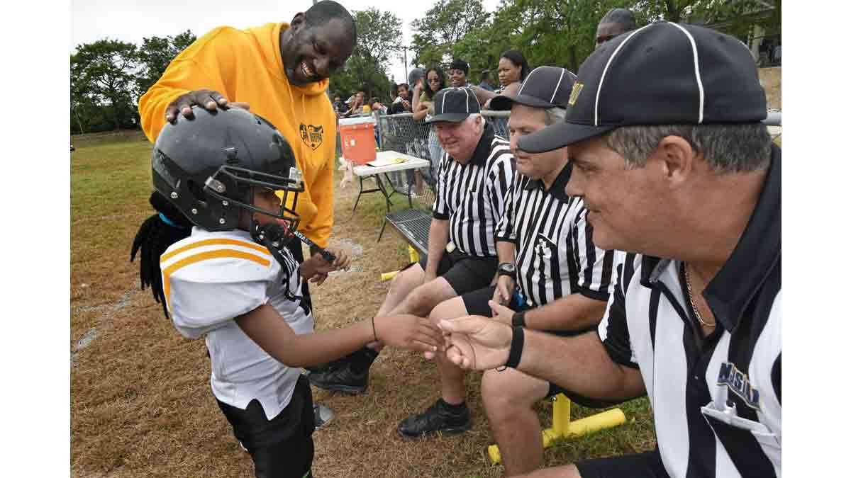 At a Simbas game in September, coach Orlando Council-Pettigrew introduces Janiyah Hill to the referees.
