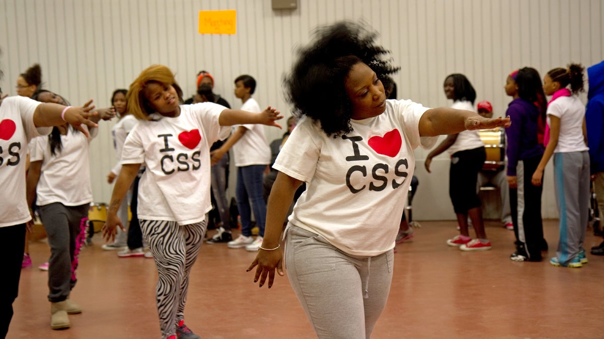 Tawanda Jones leads the Camden Sophisticated Sisters step team through a series of warm up exercises. (Lindsay Lazarski/WHYY) 