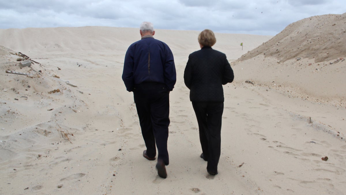 John and Mary Jane Malone walk through Camp Osborn, once crowded with tiny vacation bungalows. (Emma Lee/for NewsWorks)