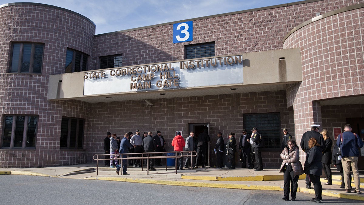  Employees and guards change shifts at the Camp Hill State Correctional Institution.  The prison has extra beds, some of which will go to Vermont inmates next month. (Lindsay Lazarski/WHYY) 