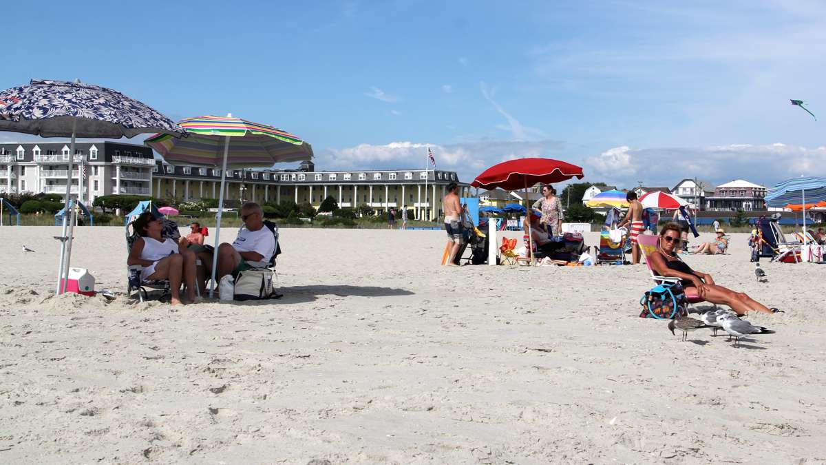 A modern beach scene shows Congress Hall, several blocks to the south of Stockton. (Emma Lee/WHYY)