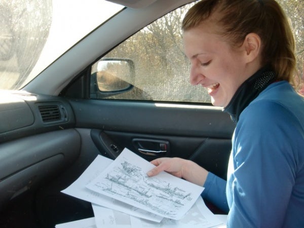 Alison Stuart of Tramps Like Us with sorting through course maps (Photo courtesy of Liz Pagonis)