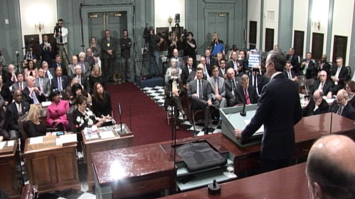  Members of the Delaware General Assembly watch as Gov. John Carney delivers an address to a joint session of lawmakers in Legislative Hall in Dover. (Paul Parmelee/WHYY) 