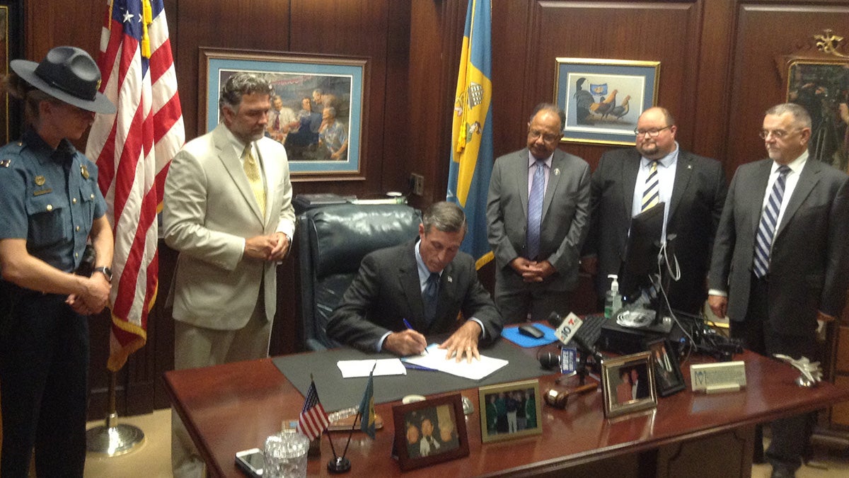  Gov. Carney signed a bill that aims to reduce illicit massage businesses. (Zoë Read/WHYY) 