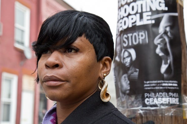 Denise Mickens's cousin was killed in a recent shooting on the block.  She supports the efforts of CeaseFire Philly. (Kimberly Paynter/For NewsWorks)