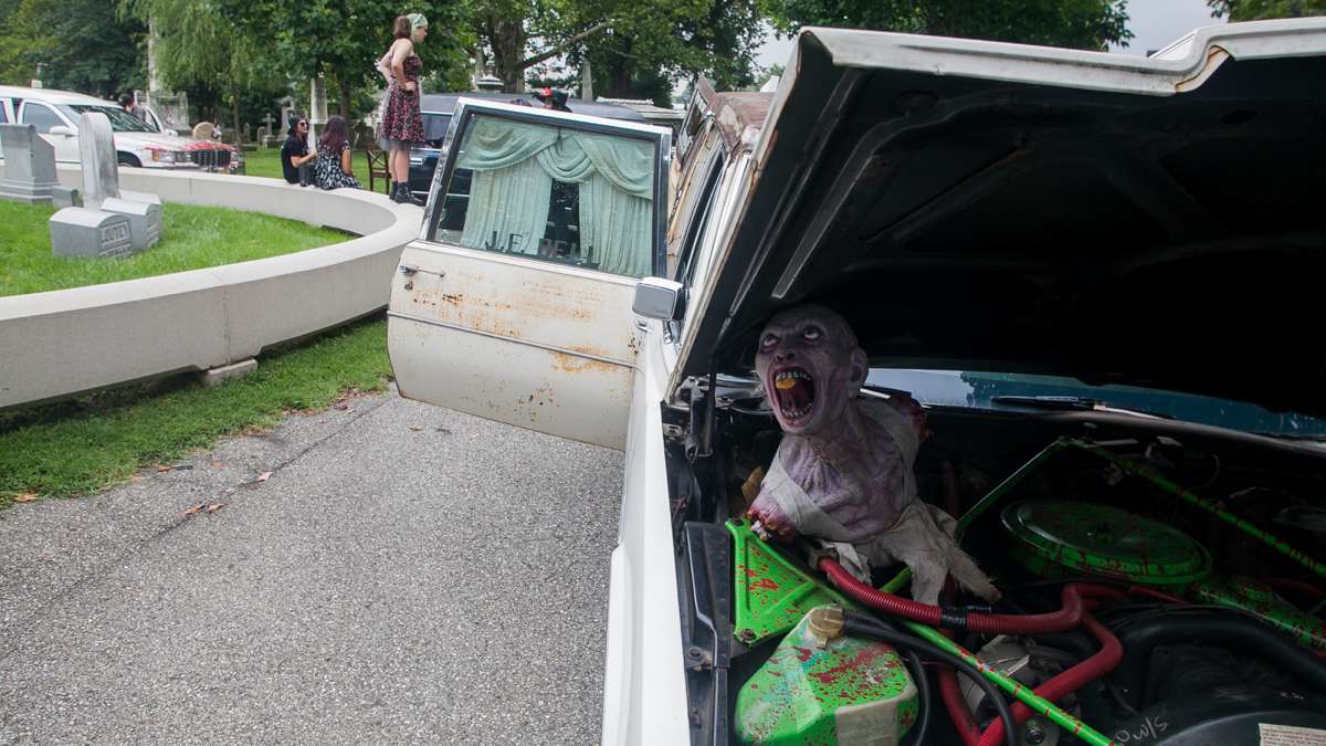 A zombie decorates the engine of a 1977 Cadillac Superior hearse. (Brad Larrison for NewsWorks)