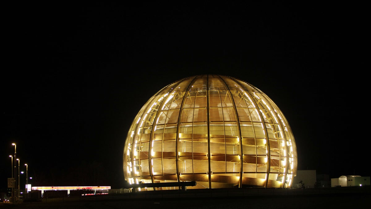  The globe of the European Organization for Nuclear Research, CERN, is illuminated outside Geneva. In 2010 scientists at the world's largest physics lab clocked subatomic particles, called neutrinos, traveling faster than light, breaking a fundamental pillar of science. (AP Photo/Anja Niedringhaus, file) 