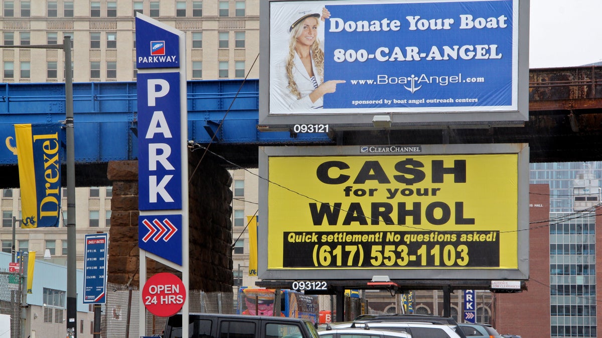  Signs popping up around Drexel offering you cash for your Warhol are the work of Boston artist Geoff Hargadon. (Emma Lee/WHYY) 