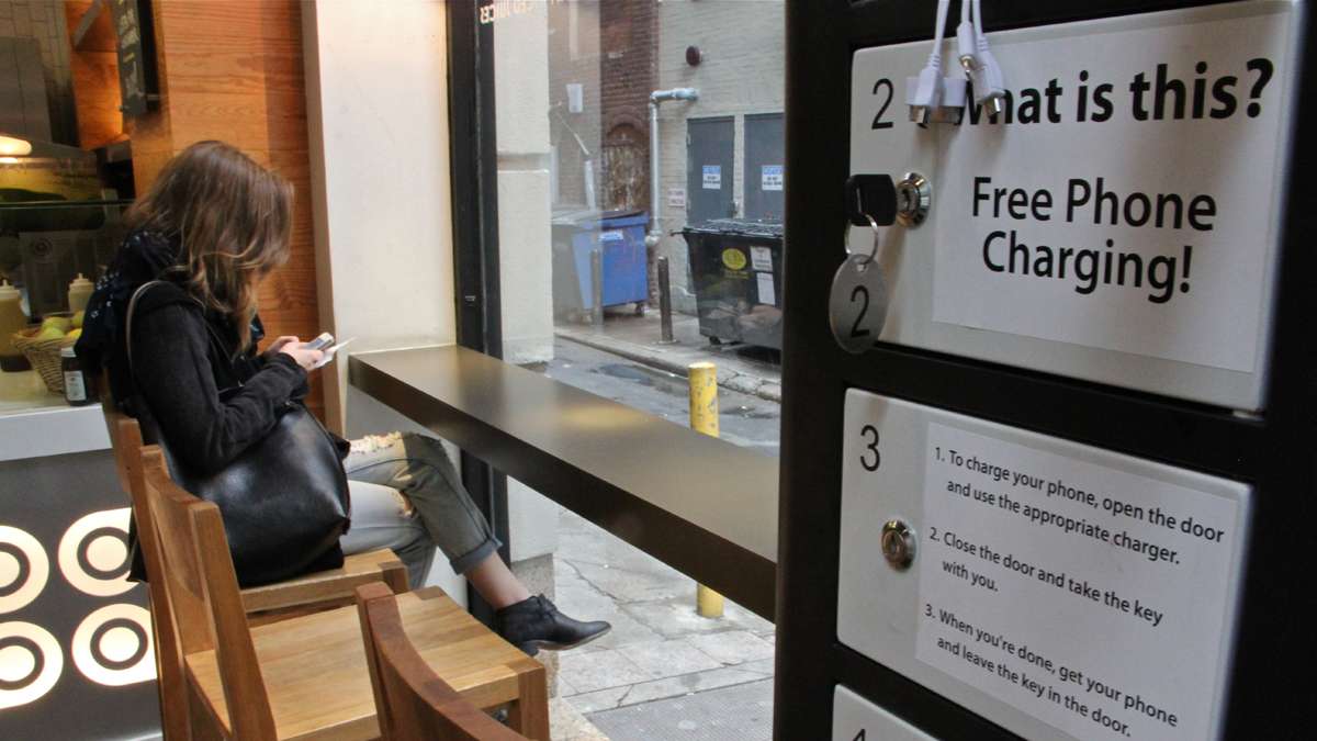 Customers at Honeygrow in Center City can charge their cell phones while they dine using one of Doug Baldasare's kiosks. (Emma Lee/for NewsWorks)
