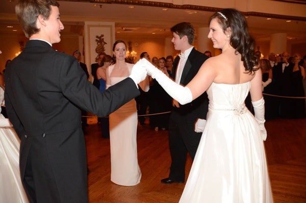 <p><p>Michael Mathew Maggio (left), Young Ladies’ Committee member Courtney Elizabeth McGill, Mr. Benjamin Magaziner Sheppard, and debutante Laura Katerina McCauley perform a formal cotillion during their presentation (Photo courtesy of Sabina Louise Pierce)<br /><br /></p></p>
