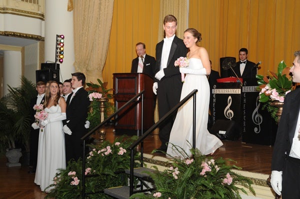<p><p>Young Ladies’ Committee member Alexandra Caroline Leto is presented to the audience with her escort John H. Durovsik. Pictured at left are members of the Young Men’s and Young Ladies’ Committee.(Photo courtesy of Sabina Louise Pierce)</p></p>
