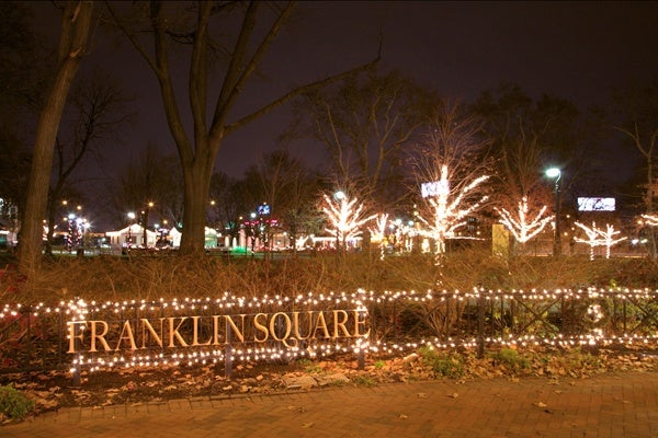 The decorated trees of Franklin Square, at 6th and Race streets in Philadelphia, sparkle at night. (Nathaniel Hamilton for WHYY)