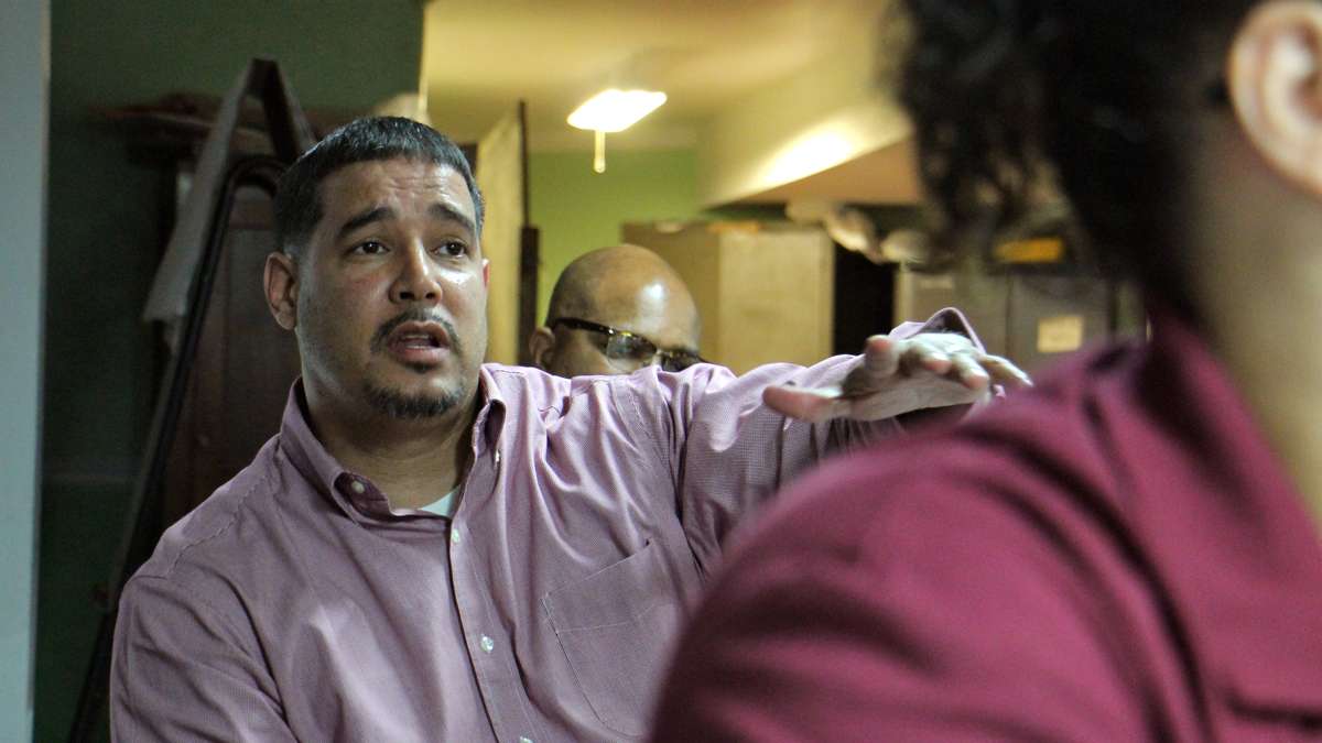 Pastor Joey Crespo of Victory Outreach men's recovery home talks about the services that will be needed as the Gurney Street heroin camp is cleaned up. (Emma Lee/WHYY)