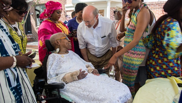  Lois Fernandez, who helped to found the celebration of African culture in 1975, talks with Pennsylvania Gov. Tom Wolf at the 42nd Annual Odunde Festival. (Emily Cohen for WHYY) 
