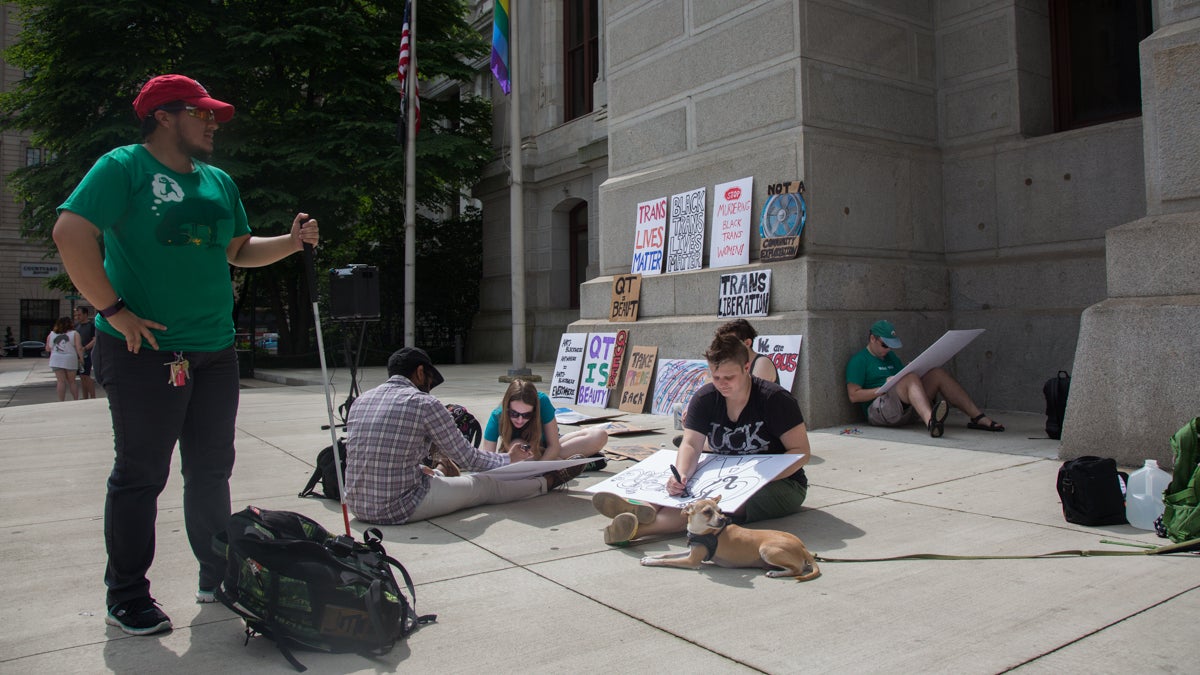  Protesters prepare signs before a rally outside of Philadelphia City Hall to recognize transgender people of color in the LGBTQ movement. (Emily Cohen for NewsWorks). 