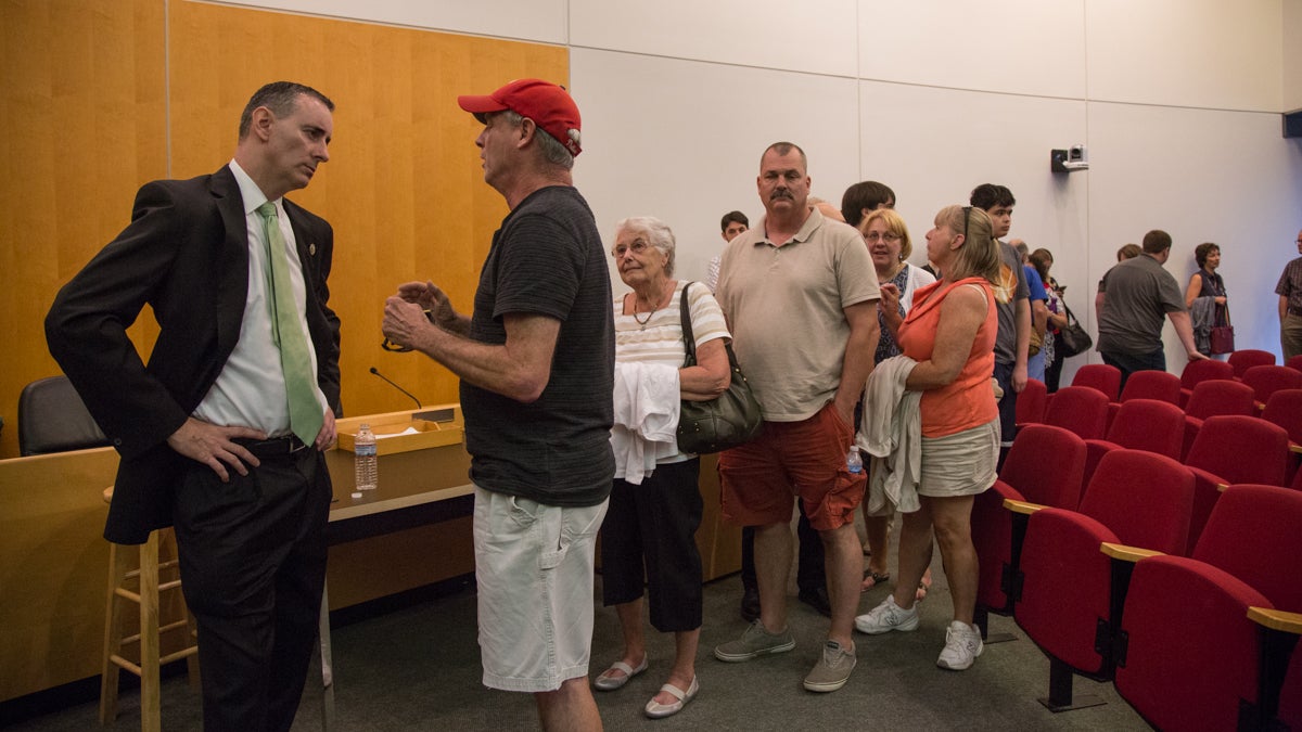  U.S. Rep. Brian Fitzpatrick of Bucks County takes individual questions after a town-hall style meeting Tuesday night in Bensalem (Emily Cohen for NewsWorks) 