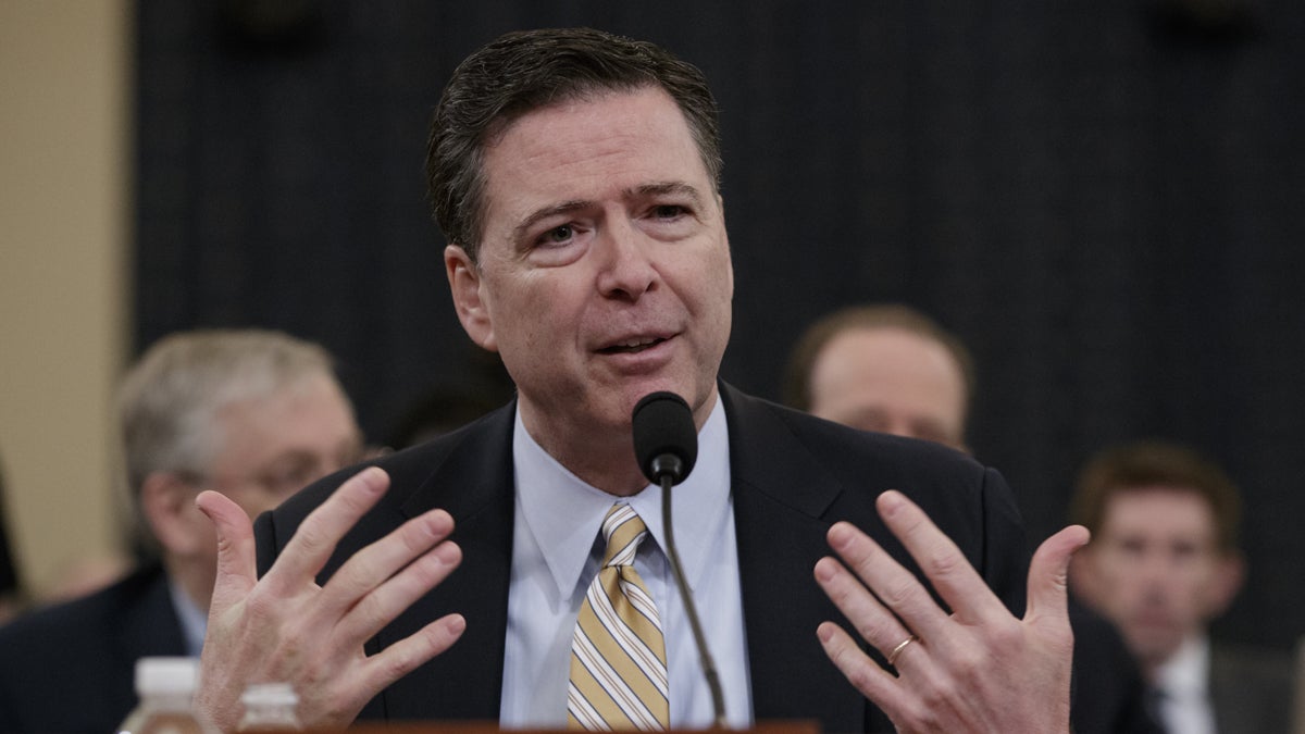  FBI Director James Comey testifies as the House Permanent Select Committee on Intelligence holds its first public hearing on allegations of Russian interference in the 2016 U.S. presidential election and the murky web of contacts between President Donald Trump's campaign and Russia, on Capitol Hill in Washington, Monday, March 20, 2017. (AP Photo/J. Scott Applewhite)                                                             