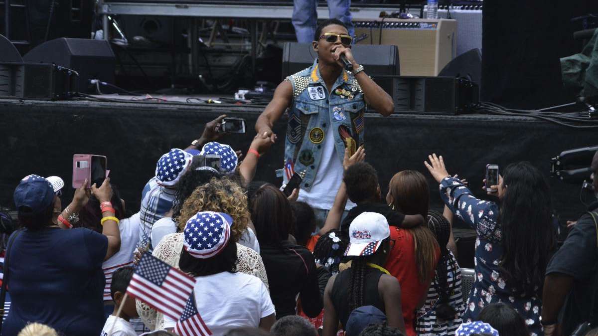 Yazz the Greatest greets fans off-stage as he performs during the Wawa Welcome America concert.